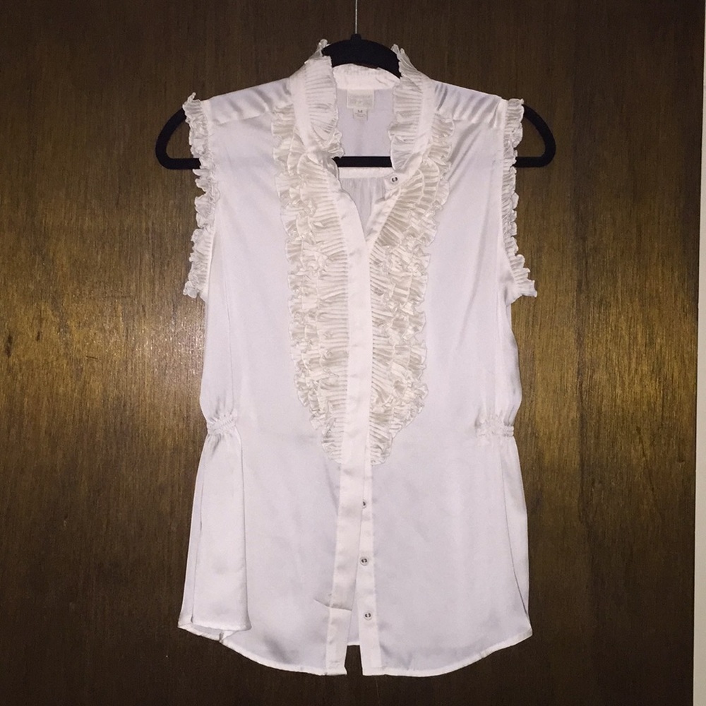 White ruffled blouse.